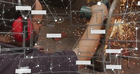 Industrial technician grinding steel with angle grinder, sparks flying, hearing protection