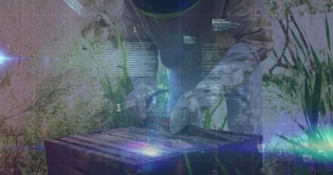 Beekeeper with Advanced Technology Modifies Beehive in Apiary