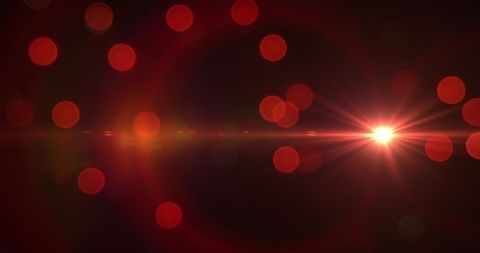Glowing Red Bokeh with Lens Flare on Dark Background - Download Free Stock Images Pikwizard.com