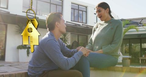 Diverse Couple Celebrating New Home Ownership Outdoors