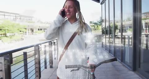 Man on Urban Rooftop Communicates via Phone and Bicycle in Hand