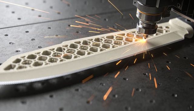 Laser cutting honeycomb lattice knife with sparks for precision industrial fabrication