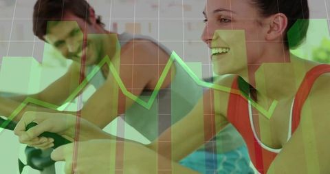 Woman Cycling on Stationary Bike with Data Overlay in Fitness Studio