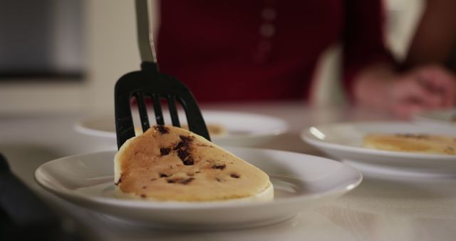 Close-up of Freshly Cooked Pancakes on Plates in Cozy Kitchen - Download Free Stock Images Pikwizard.com