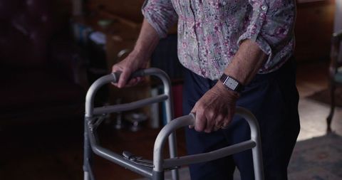 Older adult using walker in home environment