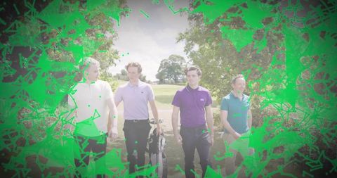 Four men walking on golf fairway wearing polos, carrying clubs, enjoying sunny leisure