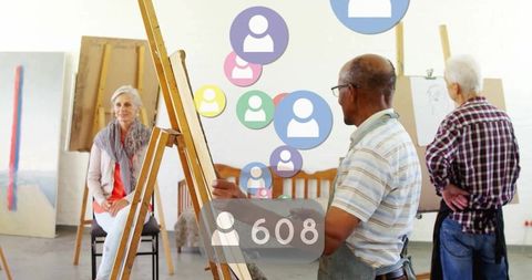 Senior Artist Painting Portrait in Classroom with Social Media Icons