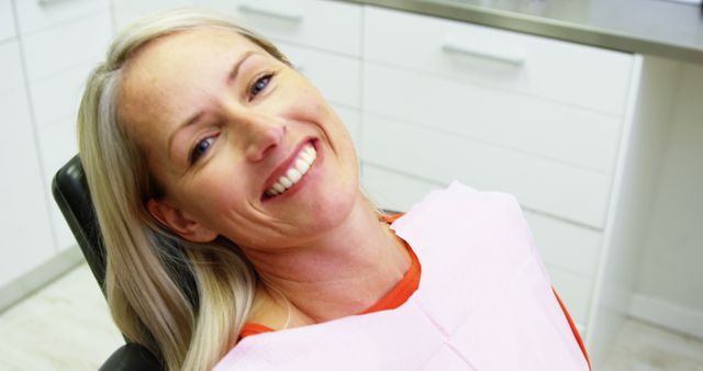 Smiling Woman in Dental Clinic Chair - Download Free Stock Images Pikwizard.com