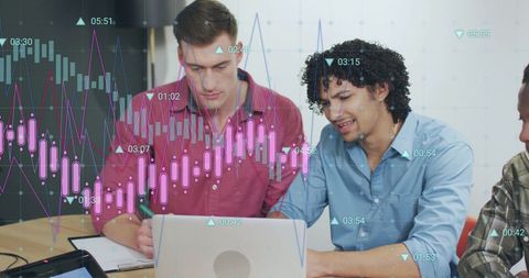 Diverse Colleagues Analyzing Financial Graph on Laptop in Modern Office