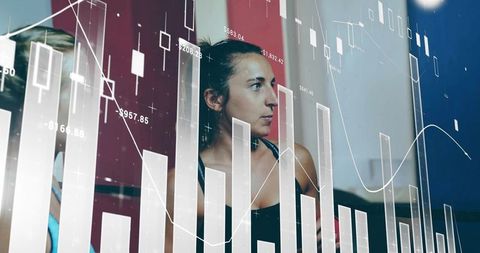 Athletic Women Analyzing Performance Data in Gym Environment