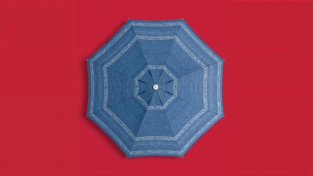 Blue Umbrella with Stripes on Vibrant Red Background