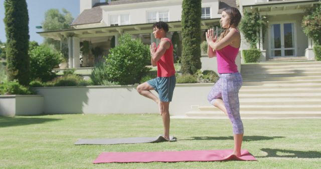 Couple Practicing Yoga Outdoors in Garden, Balancing on One Leg - Download Free Stock Images Pikwizard.com