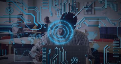 Man typing on laptop in coworking hub with futuristic holographic HUD, circuits and data graphs