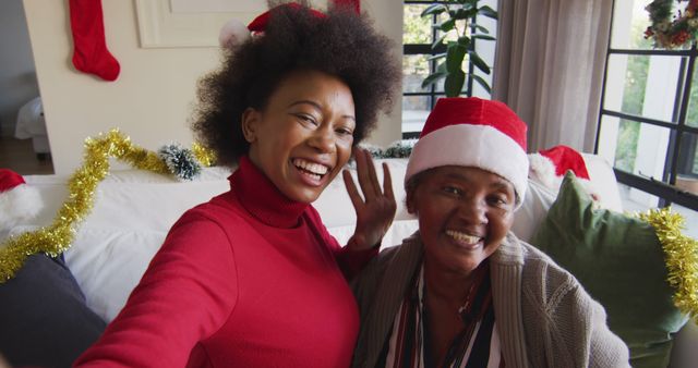Happy African American Women Celebrating Christmas at Home - Download Free Stock Photos Pikwizard.com