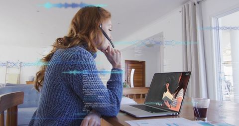 Woman Engaged in Virtual Meeting with Data Overlay at Home
