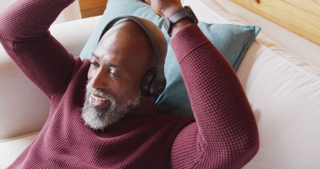 Happy Mature Man Relaxing and Listening to Music at Home - Download Free Stock Images Pikwizard.com