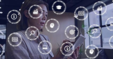 Asian businesswoman interacting with tablet and floating digital UI icons for analytics