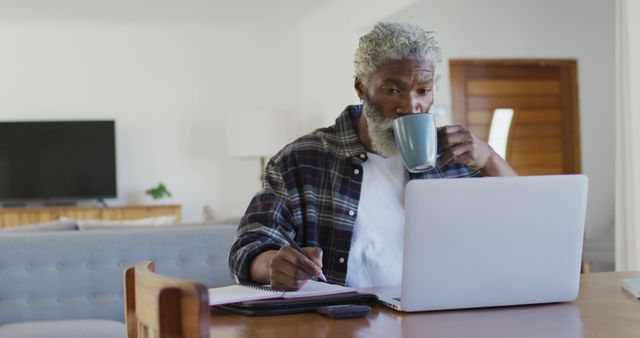 Senior Male Working from Home on Laptop and Drinking Coffee - Download Free Stock Images Pikwizard.com