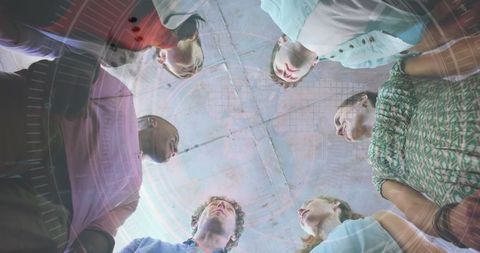 Diverse Team in Creative Collaboration with Futuristic Hologram