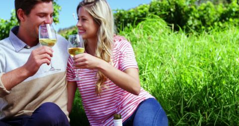 Couple Enjoying Wine Together in Lush Vineyard Scene - Download Free Stock Images Pikwizard.com