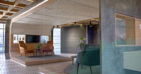 Modern office lounge showcasing raised platform, leather armchairs, greenery and glass
