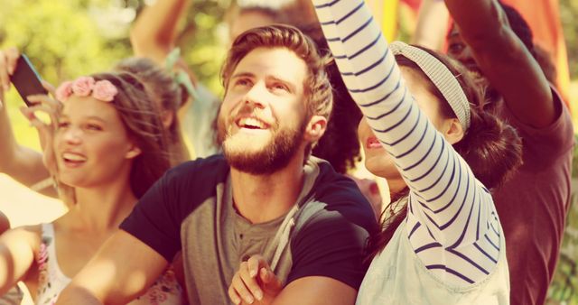 Group of Friends Enjoying Outdoor Festival Under Sunny Skies - Download Free Stock Images Pikwizard.com