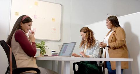 Collaborative Diverse Female Team Engaging in Office Meeting