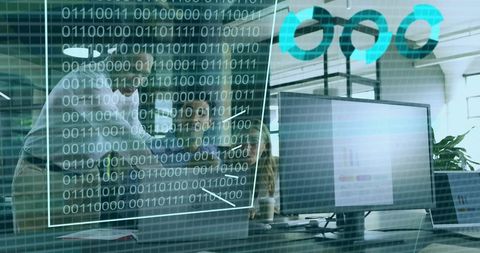 Team collaborating around laptop with augmented reality binary overlay in open office