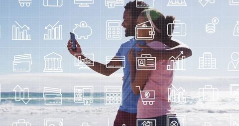 Smiling couple taking selfie on beach with tech overlay