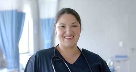 Smiling Medical Professional in Hospital Uniform