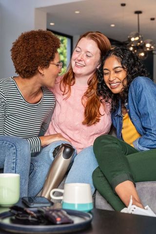 Diverse Female Friends Relaxing Together with Prosthetic Reveal
