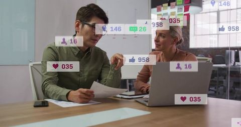 Collaborative team analyzing social media metrics in modern glass conference room