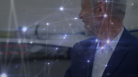 Connected Businessman Checking Smartwatch at Airport