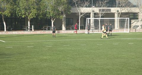 Teen Athletes Prepare on Soccer Field for Upcoming Match