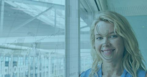 Businesswoman Analyzing Financial Charts Through Office Window