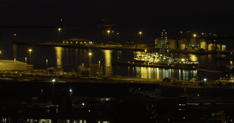 illuminated harbor reflections at night with transparent sky - Download Free Stock Videos Pikwizard.com