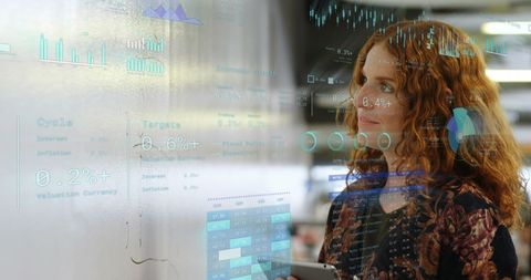 Businesswoman Analyzing Financial Projections in Modern Office - Download Free Stock Images Pikwizard.com