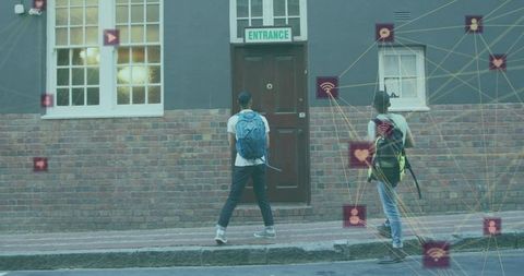 Two students standing at brick entrance carrying backpacks with social network overlay