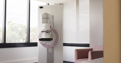 Sunlit minimalist clinic with standing mammography unit for modern breast imaging