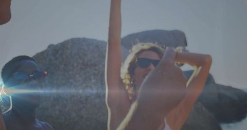 Friends Enjoying Sunny Day on Rocky Beach