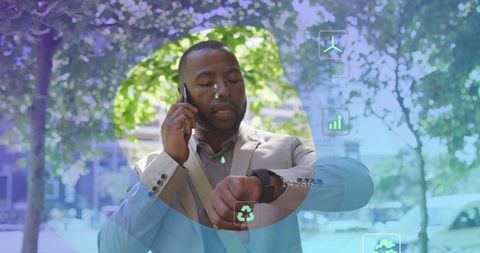Eco-friendly technology with African American businessman multitasking