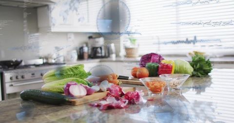 Smart kitchen preparing fresh vegetables on countertop with digital hud overlay and chef's knife