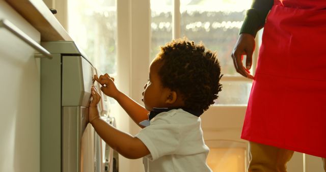 Curious Toddler with Afro Hair Helping in Cozy Kitchen - Download Free Stock Images Pikwizard.com