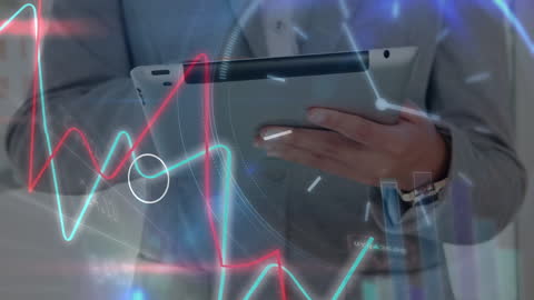 Businessman Analyzing Financial Data on Digital Tablet