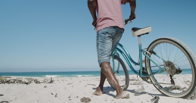 Man Walking Beach With Bicycle and Sandy Legs on Sunny Day - Download Free Stock Images Pikwizard.com