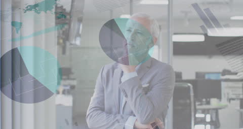 Senior Businessman Analyzing Data in Modern Office