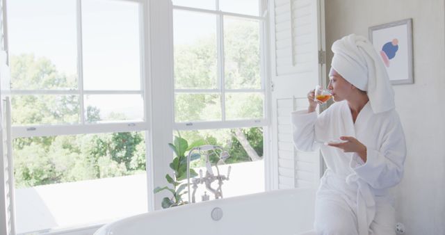 Woman Relaxing With Drink After Shower by Sunny Window - Download Free Stock Images Pikwizard.com
