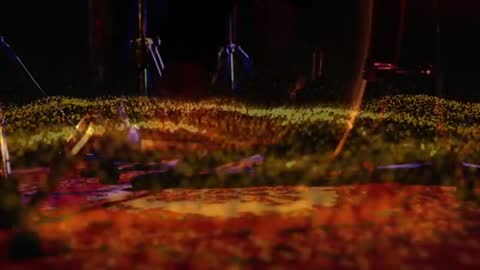 Drum Technician Adjusts Stage Equipment with Dynamic Effects