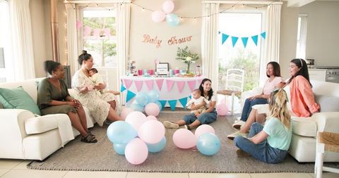 Diverse Group of Women Enjoying Baby Shower Celebration