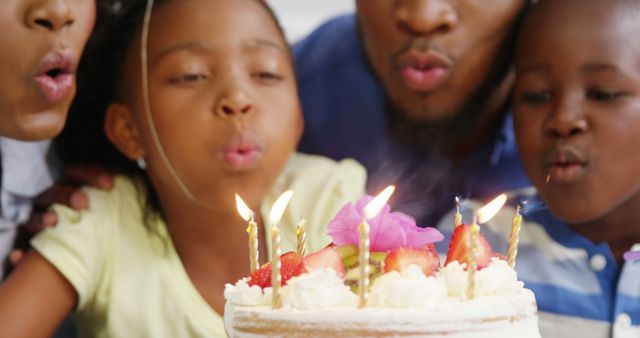 Joyful Family Celebrating Birthday, Blowing Candles Together - Download Free Stock Images Pikwizard.com